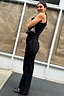 Black Scallop Detail Jeans featuring scalloped pockets and wide leg, styled with a black vest and ballet flats.
