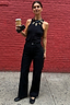 Black Scallop Detail Jeans with a wide-leg denim fit, styled with a black vest top and statement necklace.