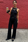 Black Scallop Detail Jeans with a wide-leg denim fit, styled with a black vest top and statement necklace.
