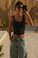 Black Scoop Neck Rib Tank in soft stretch ribbed fabric, styled with light-wash denim for a casual London look.
