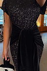 Black Sequin Bow Dress featuring shimmering sequins and a multi-wear velvet tie detail at the waist.