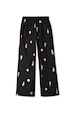 Black Shell Elissa Trousers featuring a gold shell print, wide-leg fit and elasticated waist.