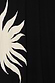 Black Sol Dorris Skirt detail featuring an in-house hand-painted sun print on black viscose jersey.