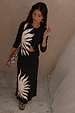 Black Sol Dorris Skirt with a cream hand-painted sun print, styled as a co-ord with a matching cardigan.