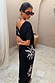 Black cotton Dolce Vita T-Shirt Dress featuring white sun motifs and Greek-inspired graphics.