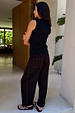 Black Studded Barrel Jeans featuring a barrel leg and silver studs along the sides and back pockets.