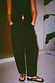 Thumbnail for Black barrel leg jeans featuring silver stud detailing along the sides and pockets, shown in a lifestyle shot.