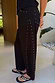 Thumbnail for Black Studded Barrel Jeans featuring silver studs along the side and pockets, styled with studded sandals.
