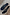 Thumbnail for Black Stud Sandal Mules in leather with silver studs, a low kitten heel and signature sun motif on a patterned rug.