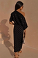 Black Tilly Dress in gold foil plisse, styled off-the-shoulder with a lettuce hem for a summer vacation look.