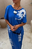 Blue Dolce Vita T-Shirt Dress featuring white sun motifs and hand-painted Greek graphics in cotton.