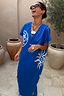 Blue Dolce Vita T-Shirt Dress with white sun motifs and Greek-inspired graphics for vacation styling.