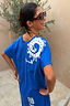 Thumbnail for Blue Dolce Vita T-Shirt Dress in cotton featuring white sun motifs and Greek artistry graphics on the back.