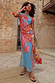 Dolce Vita Mesh Dress in blue with red swirl and eye motifs on a model in a vacation setting.