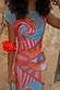 Dolce Vita Mesh Dress featuring blue and red graphic swirl and eye motifs on a semi-sheer stretch mesh base.