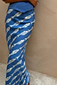 Blue Marina Dorris Skirt in blue satin featuring a white hand-painted fish print, designed in London.