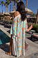 Blue Dreamer Maxi Kimono in light blue with palm and sun motifs, worn by a 5ft7 model in size M by a pool.