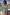 Thumbnail for Blue Dreamer Maxi Kimono in light blue with star and heart motifs, styled poolside with a tie waist and tassels.