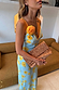 Blue Fawn Poppy Elsie Dress with yellow poppy motifs, white fawn spots and a detachable 3D flower.