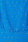 Blue Jacquard Tilly Dress detail highlighting the gold fleck print and metallic brushstrokes on vibrant blue fabric.