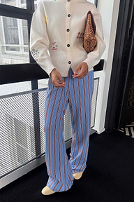 Blue Cotton Stripe Jogger with a red pinstripe print and elasticated waist, styled with an ivory embroidered cardigan.