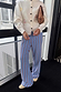 Blue Cotton Stripe Jogger with a red pinstripe print and elasticated waist, styled with an ivory embroidered cardigan.