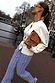 Blue Cotton Stripe Jogger with red pinstripe detail, styled with a cream cardigan and leopard print clutch.