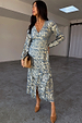 Blue Lottie wrap dress in gold jacquard sheer crepe with a V-neckline and long sleeves, shown in a studio setting.