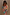 Thumbnail for Blue Mari Aria Mesh Dress with a multi-colour paisley print, flared sleeves and a beaded clutch bag.