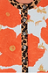Thumbnail for Blue Poppy Cardigan detail with bold orange poppies on pale blue knit and iconic leopard print collar and button stand.