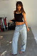 Blue Scallop Detail Straight Leg Jeans in light wash denim styled with a black vest top.