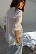 Blue Scallop Detail Straight Leg Jeans styled with a white shirt, showcasing the unique scalloped back pockets.