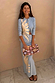Ice Blue Sol Alexa Cardigan featuring a hand-painted sun print, worn as a co-ord with a matching midaxi skirt.