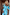 Thumbnail for Blue Stripe Kiki cotton peplum top with elasticated puff sleeves and matching trousers in a vacation setting.