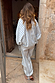 Blue Stripe Cara Shirt in cotton with gold studs and tie cuffs, styled as an NFD co-ord set from the back.