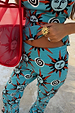 Blue Sun Foldover Trouser featuring Mediterranean sun prints on a blue jersey base with a foldover waistband.