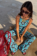 Blue Sun Foldover Trouser with a hand-painted sun print, styled as a co-ord in bright blue jersey.