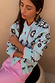 Blue Sun Hollie Cardigan in baby blue knit with a pink sun face print and contrasting pink ribbed trims.