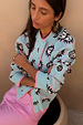 Blue Sun Hollie Cardigan in baby blue knit with a pink sun face print and contrasting pink ribbed trims.