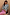 Thumbnail for NFD Blue Sun Hollie Cardigan in baby blue soft-touch knit with a pink sun print, worn by a model.