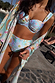 Blue Dreamer Bikini Top with a joy-filled celestial sun and star print, underwired cups and adjustable straps.