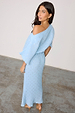 Ice Blue Plisse Tilly Dress with a silver brushstroke print and a voluminous off-the-shoulder top on a model.