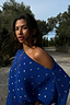 Thumbnail for Off-the-shoulder Blue Tilly Plisse Dress in cobalt blue with silver dots worn by a model outdoors.
