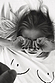Iconic white Boob T-shirt with line drawing detail on a model lying down in black and white.