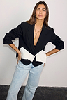Black Bow Crop Blazer with a large white bow detail and button fastening, styled with light-wash jeans.
