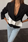 Black Bow Crop Blazer with a white satin bow, styled with light wash jeans and a gold heart necklace.