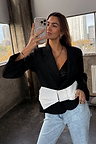 Black Bow Crop Blazer with a statement white bow, styled over a sequin top and light wash jeans for a dopamine dressing look.