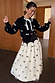 Black Bow Sophie Cardigan with cream 3D bows and tie neck fastening, styled with a matching bow tulle skirt.
