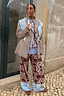 Thumbnail for Chocolate Bandana Wide Leg Trousers in brown knit with a blue hem, styled with a layered blazer and clear umbrella.