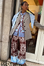 Chocolate Bandana Wide Leg Trousers in a brown knit with a blue hem, styled as a London look co-ord.